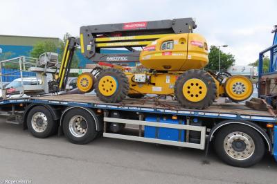 image showing a large yellow on-track machine
