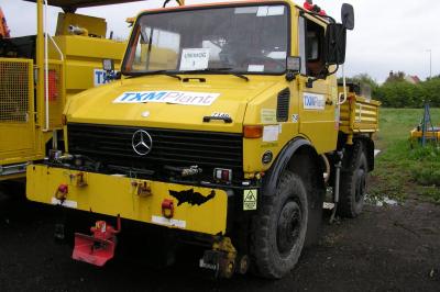 image showing a large yellow on-track machine
