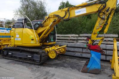 image showing a large yellow on-track machine