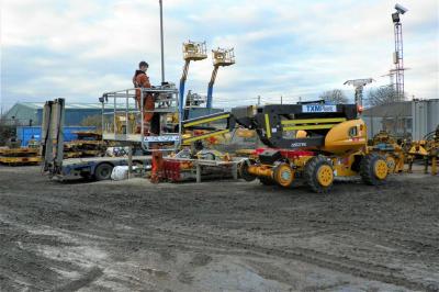image showing a large yellow on-track machine