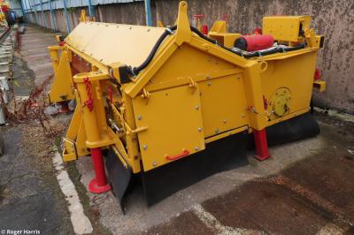 image showing a large yellow on-track machine