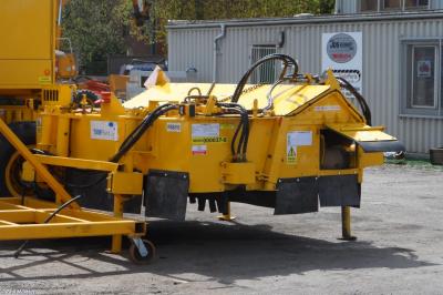 image showing a large yellow on-track machine