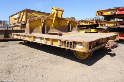 image showing a large yellow on-track machine