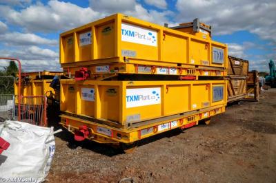 image showing a large yellow on-track machine
