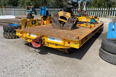 image showing a large yellow on-track machine