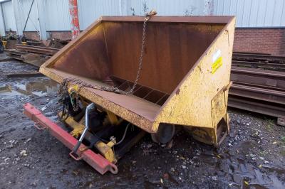 image showing a large yellow on-track machine