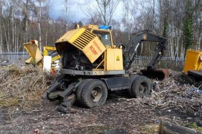 image showing a large yellow on-track machine