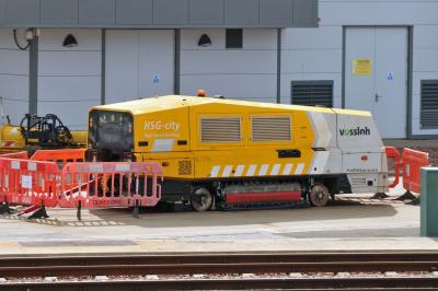 image showing a large yellow on-track machine
