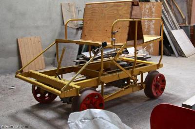 image showing a large yellow on-track machine