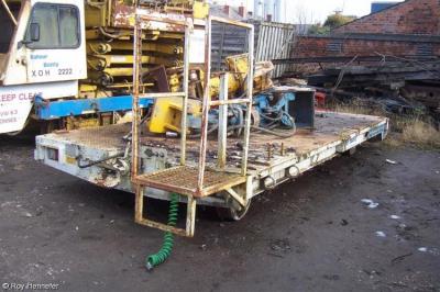 image showing a large yellow on-track machine