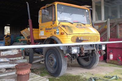 image showing a large yellow on-track machine