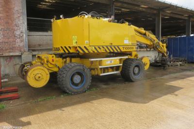 image showing a large yellow on-track machine