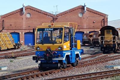 image showing a large yellow on-track machine