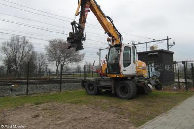 image showing a large yellow on-track machine